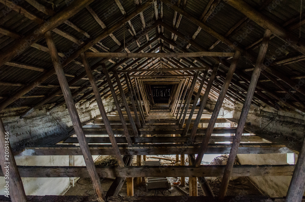 The roof of the building. The rafter system rests on the walls
