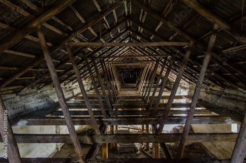 The roof of the building. The rafter system rests on the walls