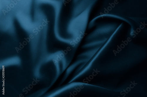 Elegant blue satin silk with waves, abstract background