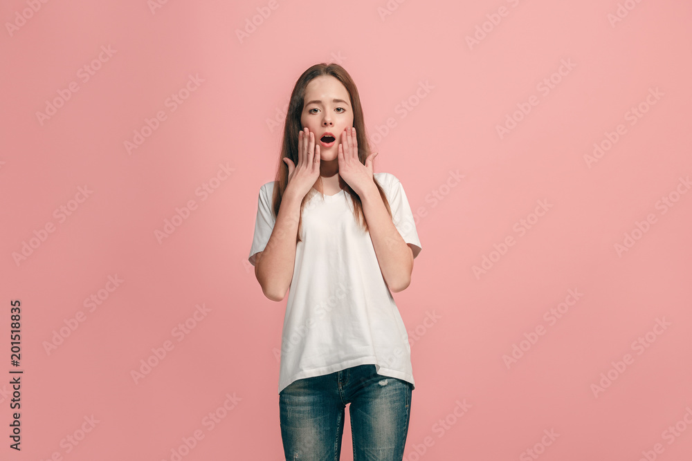Beautiful teen girl looking suprised isolated on pink Beautiful teen girl looking suprised isolated on pink