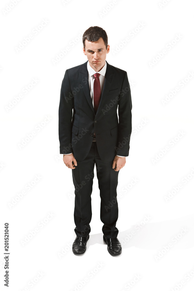 Above front portrait of a businessman with very serious face. Confident professional with piercing look in the foreground of the camera. Above front portrait of a businessman with very serious face. Confident professional with piercing look in the foreground of the camera.
