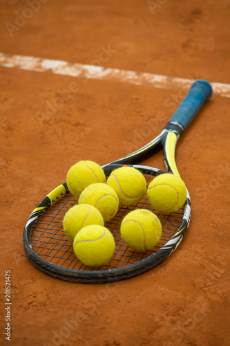 Close up view of tennis racket and balls © Gianni Caito