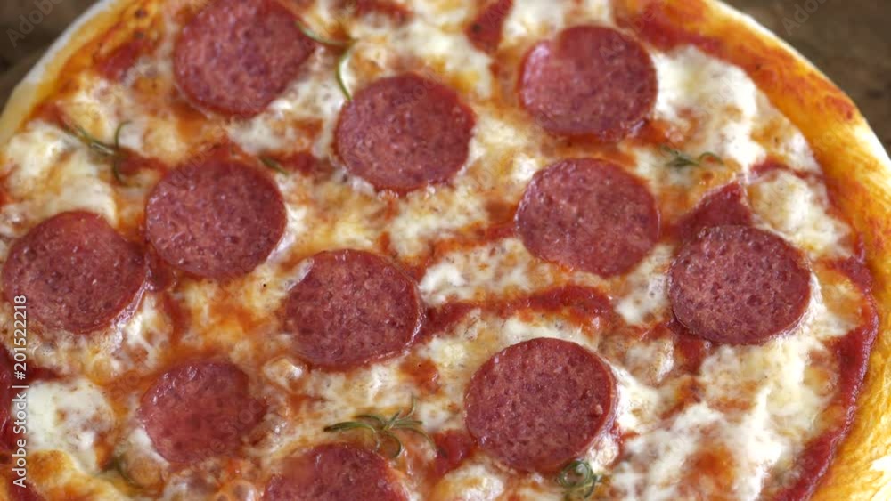 Hot pizza. Boiling cheese and sauce with slices of salami. Prepares Pizza Hot pizza. Boiling cheese and sauce with slices of salami. Prepares Pizza