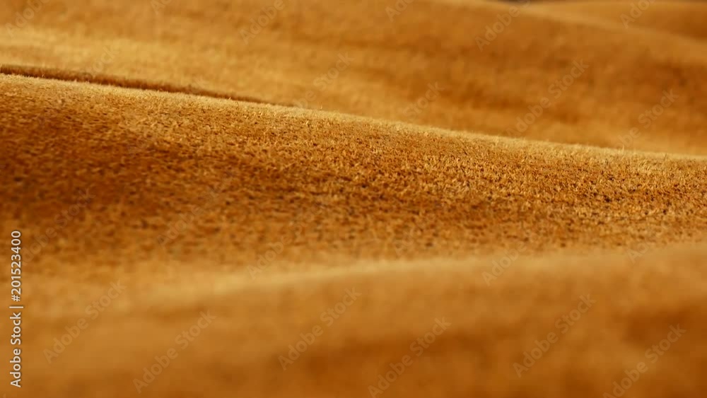 Old aged suede leather background. Coarse texture, gradient yellow brown beige, vivid colors. Old aged suede leather background. Coarse texture, gradient yellow brown beige, vivid colors.