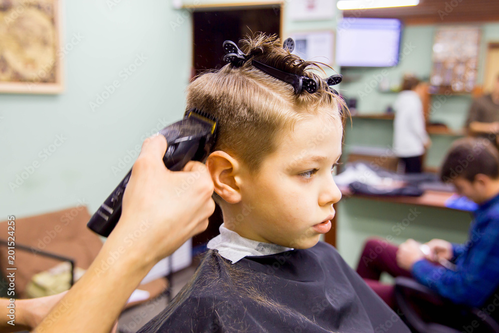 Fototapeta premium kid in barbershop