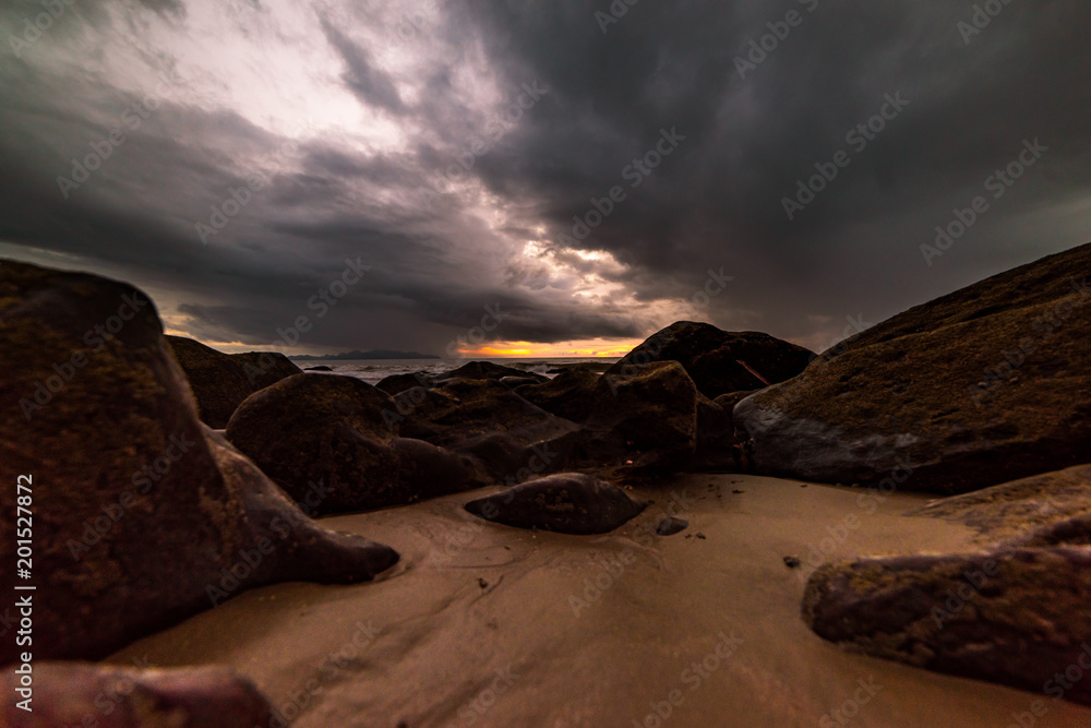 The rocks on the beach are stormy. The rocks on the beach are stormy.