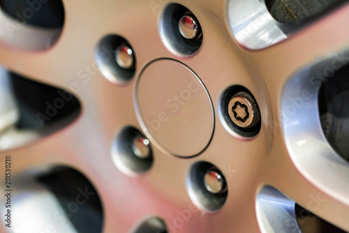 Bild auf Leinwand Anti-theft bolts in car wheel close
