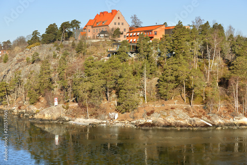 Stockholm archipelago. Houses on rocky island in early spring