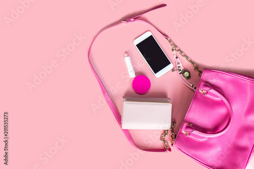 Canvas Print Top view of Women bag and lady stuff with copyspace on pink background, vigtage
