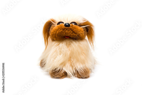 Yellow and brown dog toy on white background photo