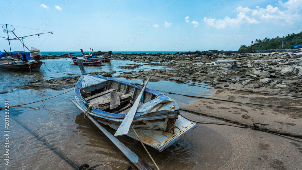 Wooden Boat On Sand Beach