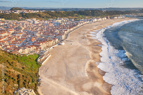 Scenic aerial view of seascape and beach waterfront from popular Miradouro do Suberco viewpoint in Nazare city photo