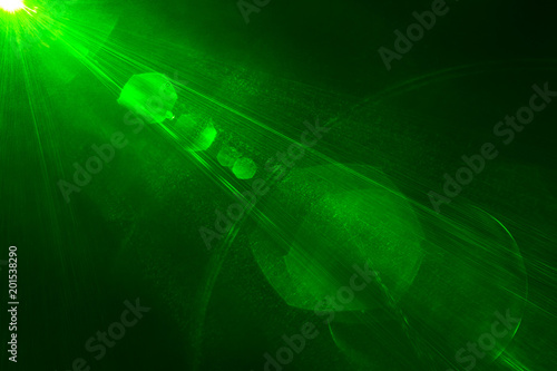 Camera lens flare by laser light create hexagons of objective iris shapes of number depending on number of lens surface and interferent effect and moire on digital sensor on dark black background