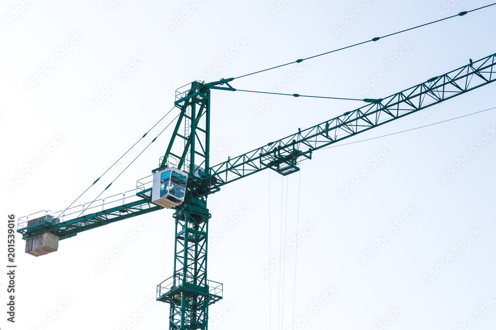 green construction crane, close-up photo, background image green construction crane, close-up photo, background image