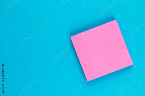 pink post on blue background with copy space