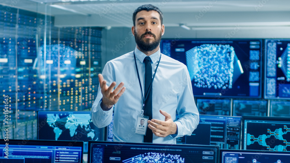 In the World's Top Machine Learning Facility Scientist Excitedly Describes Project He Works on. Background Shows Screens with Working Neural Network/ Artificial Intelligence. In the World's Top Machine Learning Facility Scientist Excitedly Describes Project He Works on. Background Shows Screens with Working Neural Network/ Artificial Intelligence.