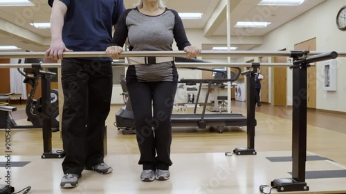 Medium shot of a senior woman doing squats photo