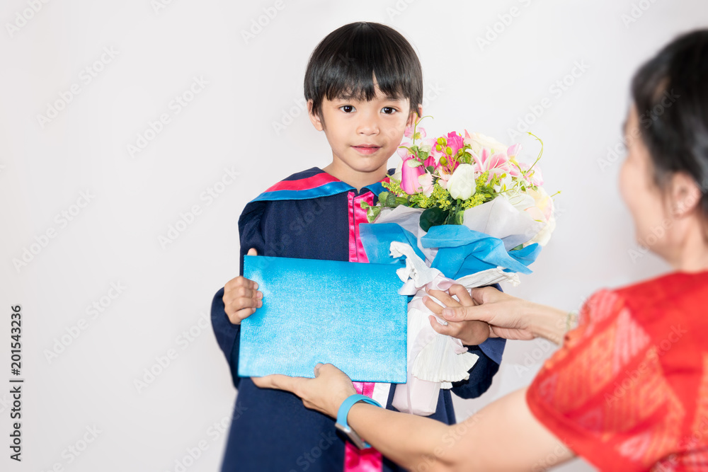 happy kid or cute child on kindergarten graduated dress on gray white background happy kid or cute child on kindergarten graduated dress on gray white background
