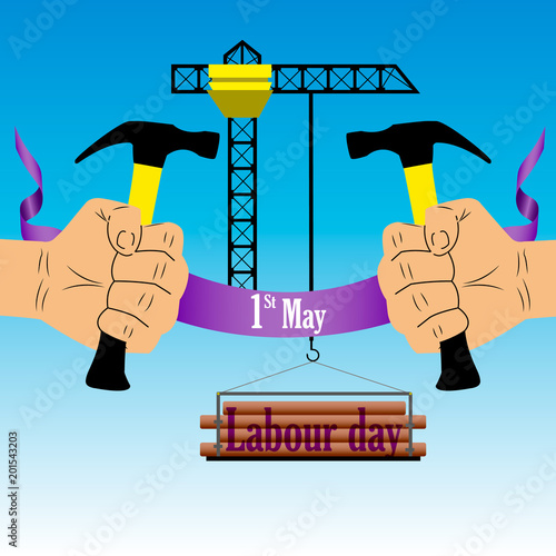 Labour day on May 1 with a hammer in hand on a blue background photo