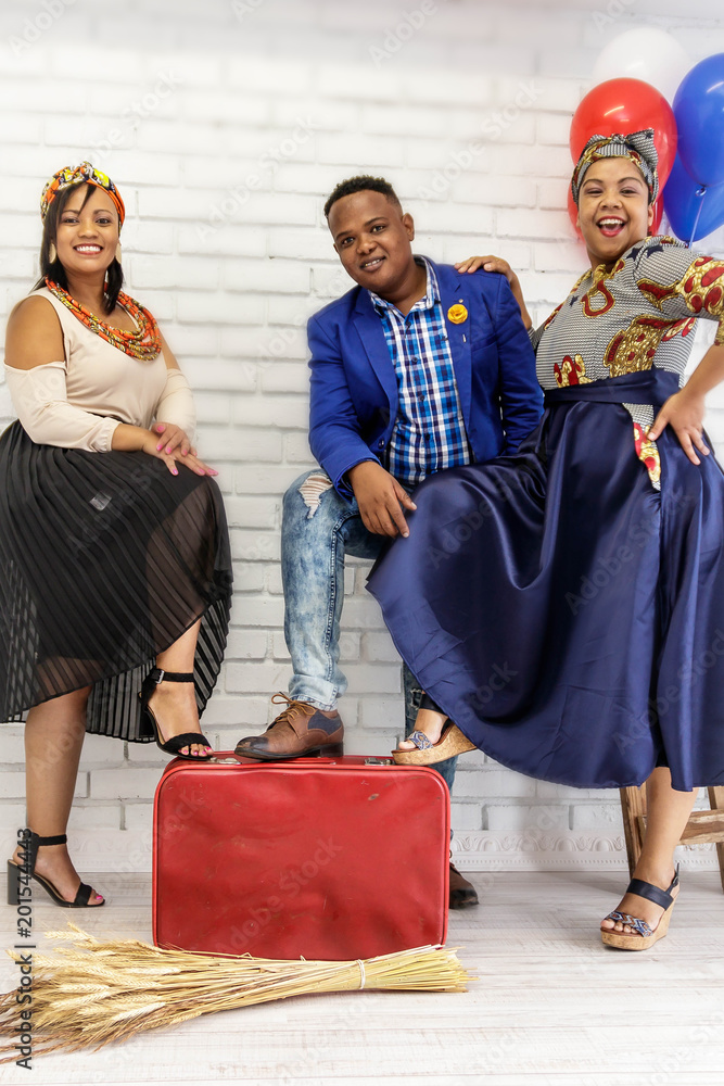 Modern South African people wearing traditional Shwe shwe fashion