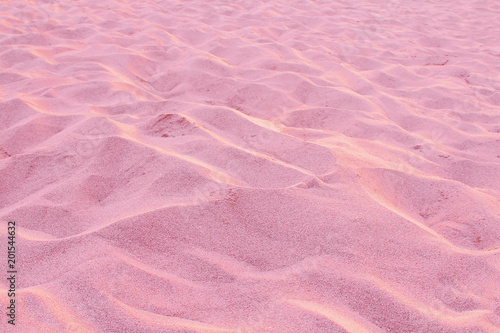 Red beach sand. Background. Texture.