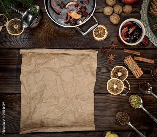 empty scroll of brown paper and ingredients for mulled wine