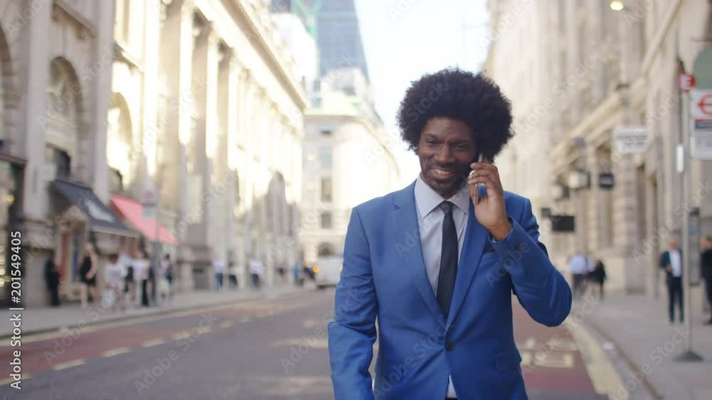 Attractive business man gets good news and dances in the street Attractive business man gets good news and dances in the street