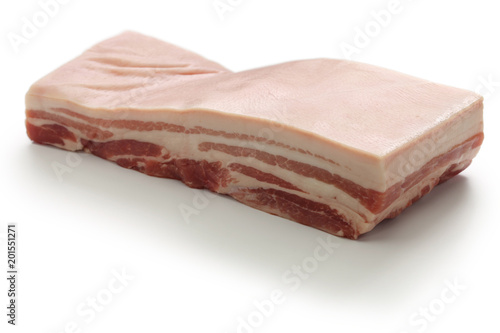 raw pork belly with rind isolated on white background