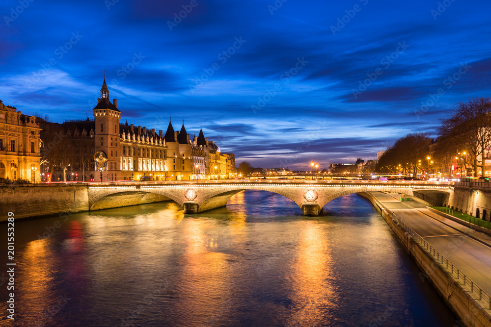 Paris by night, river Seine, illuminated street and building, France