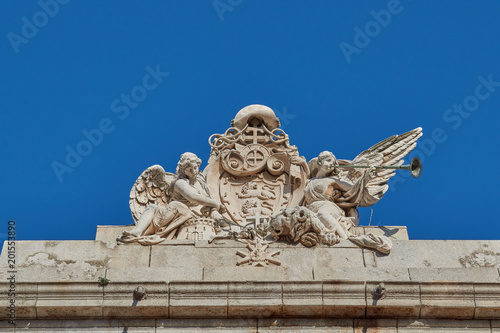 Figures of winged women of the Lorenzana University Palace in Toledo, Spain. photo