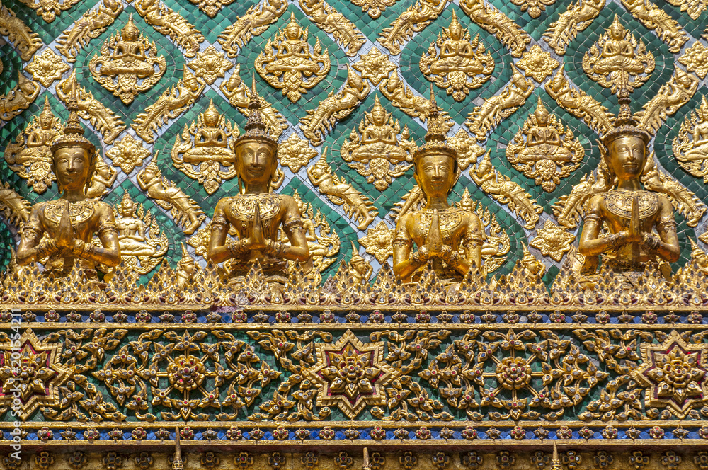 Mosaic encrusted wall of the Phra Mondop library building on the grounds of the Grand Palace Bangkok Thailand.