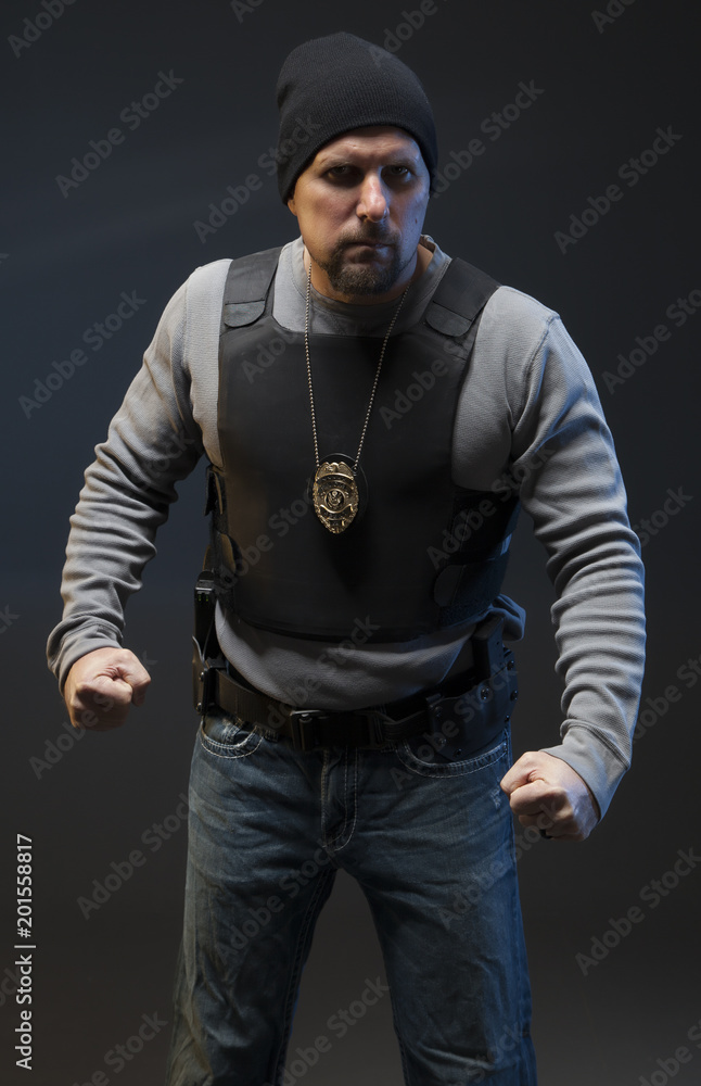 Police officer on dark background ready to fight. Police officer on dark background ready to fight.