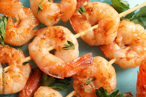 Skewers with delicious fried shrimps, closeup