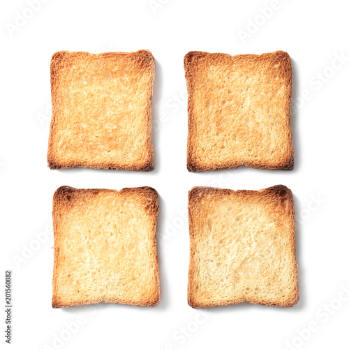 Toasted bread on white background, top view