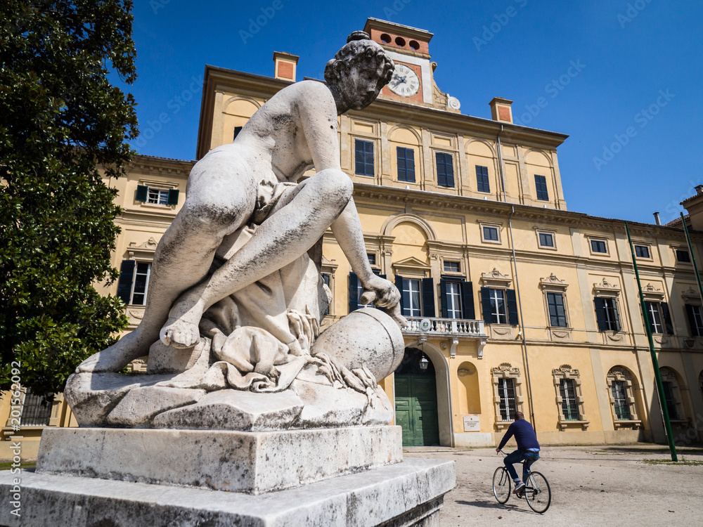 Classical style stone statue in front of the 