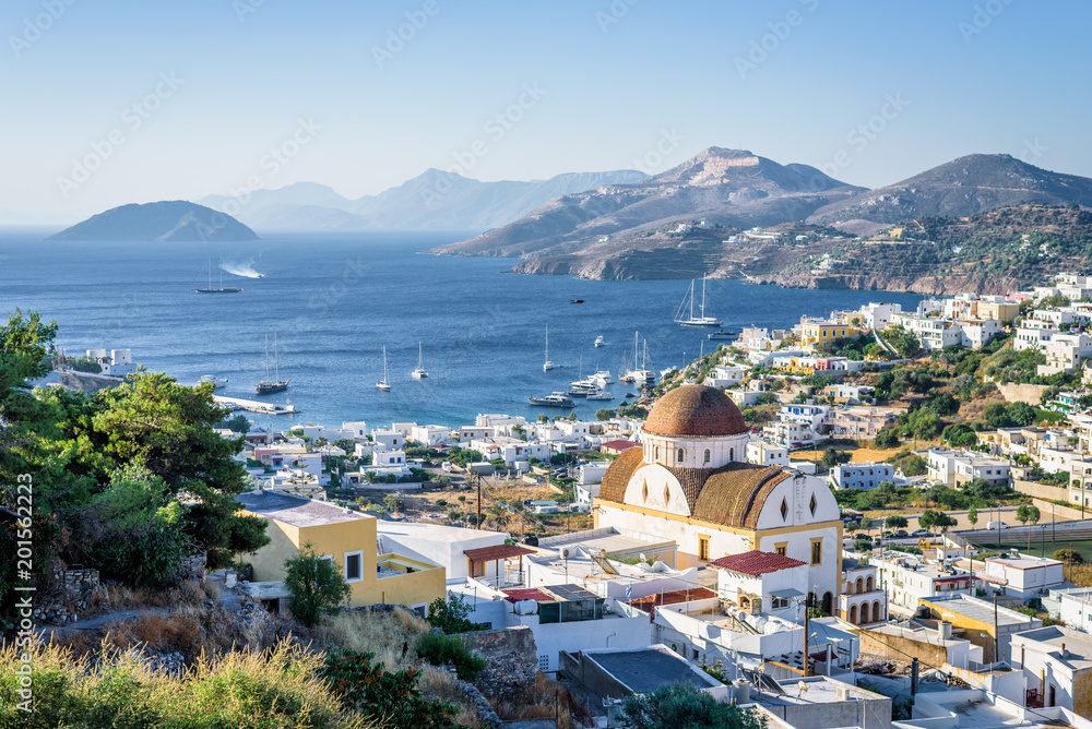 Beautiful mediterranean greek village Pantelis sourrounded by a mountain with ancient castle located at the aegean sea with colorful houses and lovely churches basilicas, Leros, Dodecanese, Greece
