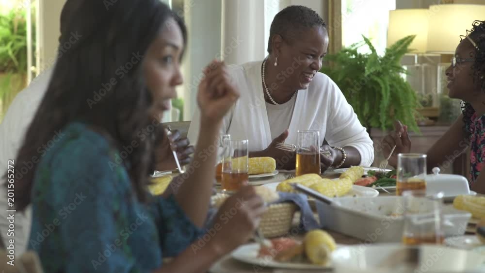 Panning shot of a family meal Panning shot of a family meal