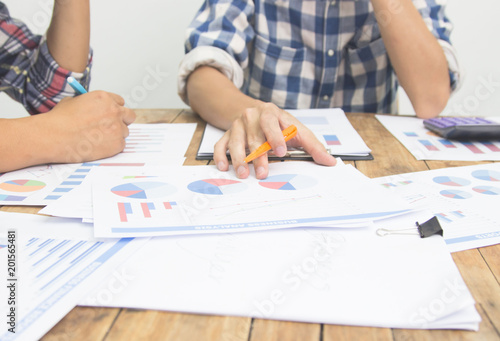 Business team financial plan and analyzing investment charts in office.