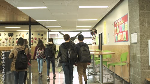 Medium shot of students walking in school restaurant