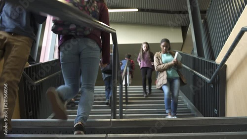 Wide shot of students descending on stairs