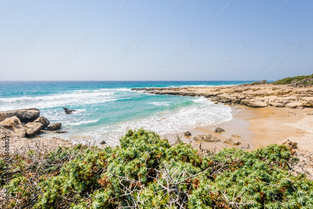 Beautiful sunny coast view to greek beach mediterranean blue sea with crystal clear water and pure white sand empty place with some mountains rocks, Theologos, Kefalos, Kos, Dodecanese Islands, Greece