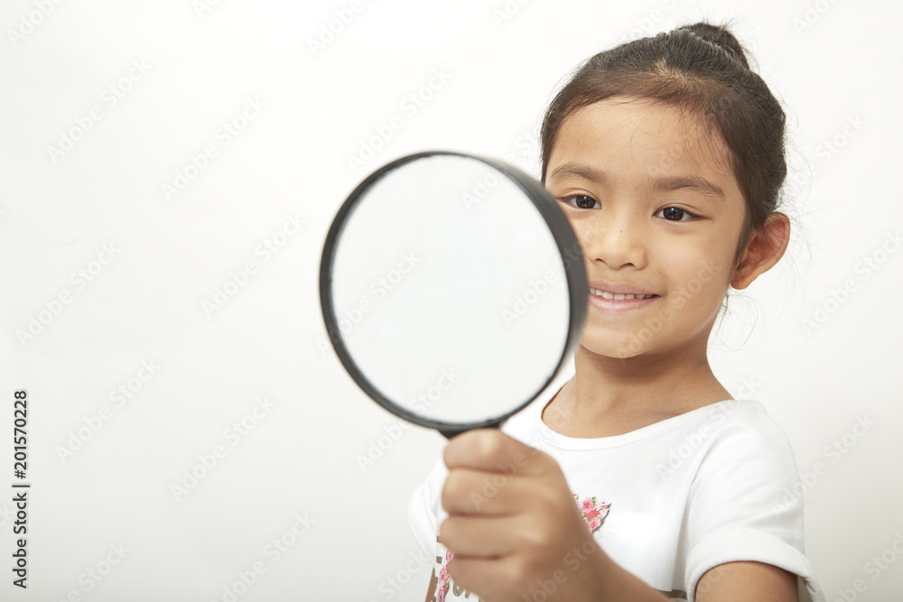 asian child girl with a magnifying glass asian child girl with a magnifying glass