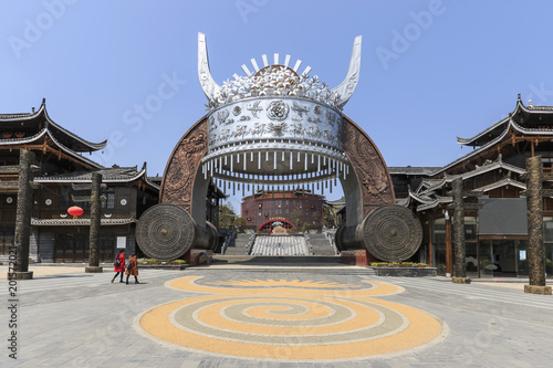 Xijiang, China - March 26, 2018: Statue of Miao traditional hat at the entrance of Xijiang Miao Nationality village photo