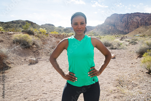 Strong, healthy African American woman working out in desert
