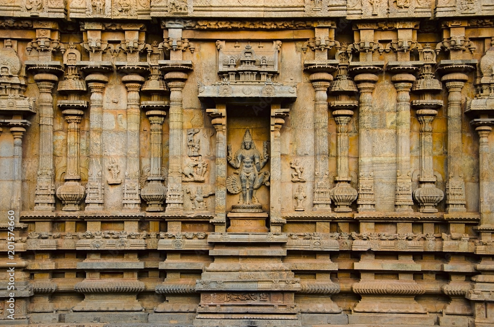 Carved pillars and idols on the outer wall of the Brihadishvara Temple, Thanjavur, Tamil Nadu, India