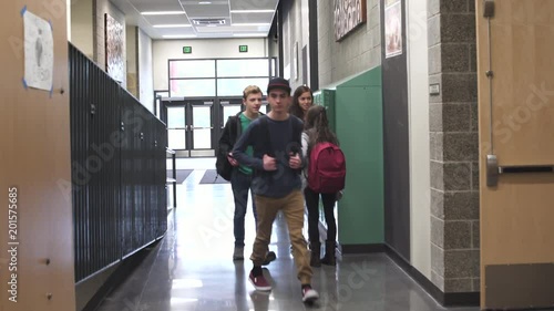 Wide shot of security person chasing young boy
