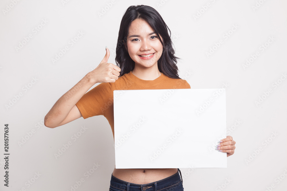 Young Asian woman show thumbs up with white blank sign. Young Asian woman show thumbs up with white blank sign.