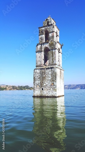 Bell Tower of the flooded church XVI century, Señor San Luis Rey de Francia, in the Villa de Carbon, reservoir Taximay, State of Mexico, Mexico photo