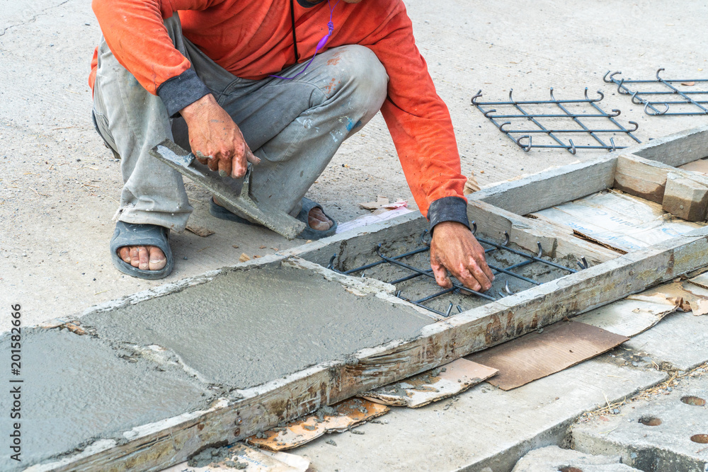 Worker was construction pipe cap cement. Worker was construction pipe cap cement.