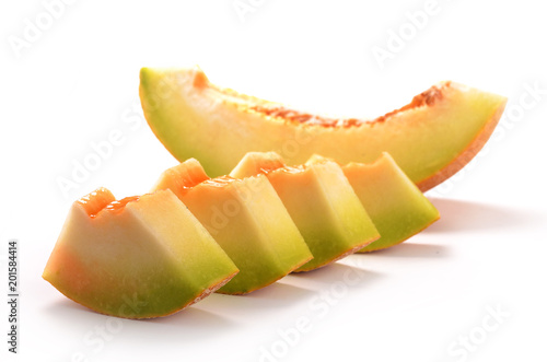 Sliced yellow honeydew melon isolated on white background